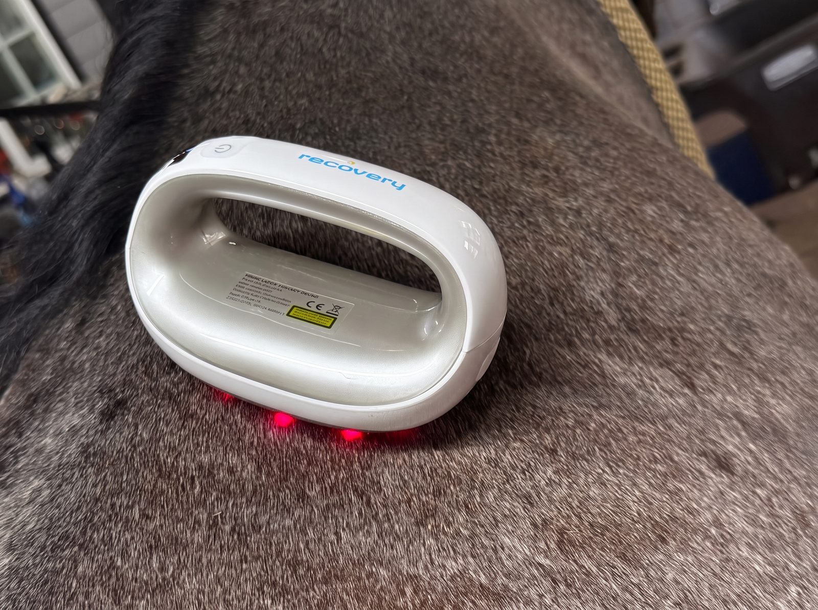 Questrian Recovery resting on a horse’s coat, its broad plate and red treatment lights visible